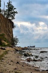 Beautiful landscape on the Polish Baltic Sea. Beach with stones and a beautiful cliff in Gdynia Orlowo, Poland. - 626415549