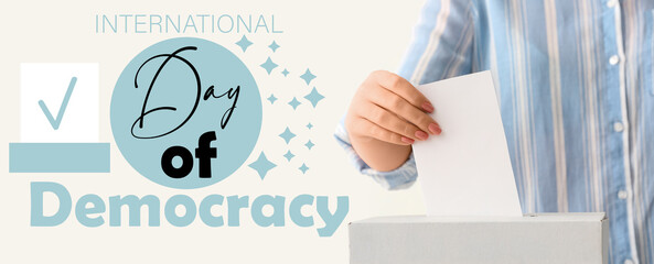 Banner for International Day of Democracy with voting woman