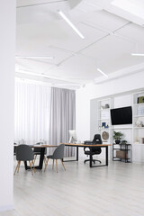 Stylish office with comfortable furniture and tv zone. Interior design