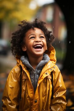 A Happy African American Kid Playing In The Rain. Generative AI. 