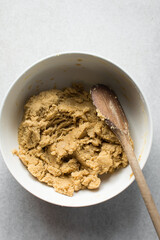 vanilla cookie dough in a white mixing bowl, plain vanilla cookie dough about to be baked
