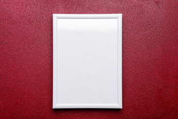 Blank photo frame on red background