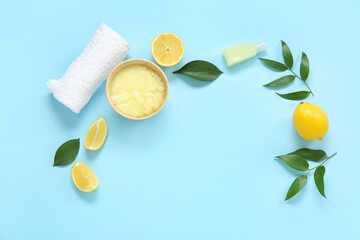 Bowl of lemon body scrub with cosmetic bottle and towel on blue background - Powered by Adobe