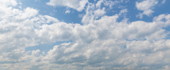 sky replacement panoramic looking up at sunny blue sky with white clouds