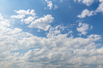 sky replacement looking up at summery blue sky white clouds in summer