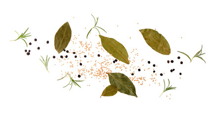 Flying peppercorns, mustard seeds and bay leaves on white background