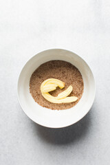 Top view of Butter cinnamon and sugar in a white mixing bowl