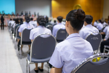 Adult students participating in a seminar in the conference hall