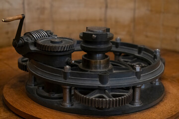 Image of an antique turbine hand crank generator invented in the mid 19th century. Focus on...
