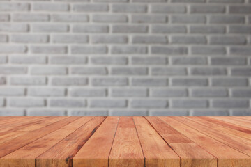perspective wooden board over blurred white wall