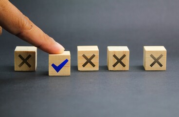 wooden cube with wrong and right sign icon. selection or checklist concept. True and false symbols accept rejected for evaluation. yes and no concept 