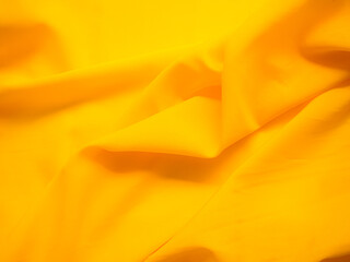 Obraz premium Yellow Fabric Background, Texture Orange Satin Clothes, Wave Surface Pattern Cotton 