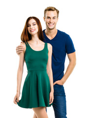 Fototapeta premium Image of smiling young couple. Full body length portrait of standing close and looking at camera models at happy in love studio concept, isolated on white background. Man and woman posing.