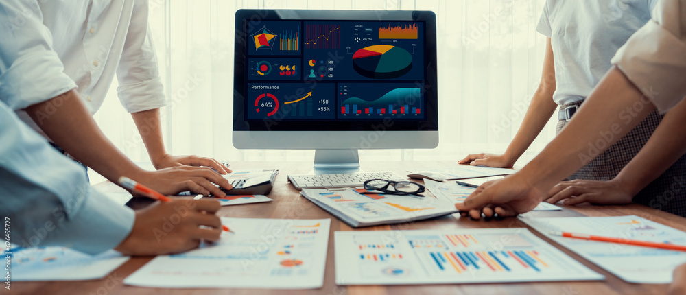 Leinwandbilder panorama shot analyst team utilizing bi fintech to analyze financial report with laptop. businesspeo