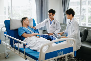 Hospital Ward Male and Femle Professional Asian Doctors Talk with a Patient, Give Health Care Advice, Recommend Treatment Plan with Advanced Equipment .