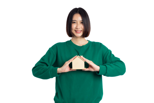 Young asian woman smiling wear green shirt holding house sample model isolated on white background, Real estate and home insurance concept - Powered by Adobe