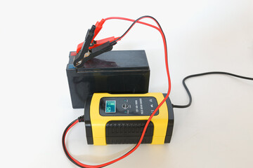 Battery pulse charger and dry battery on white background
