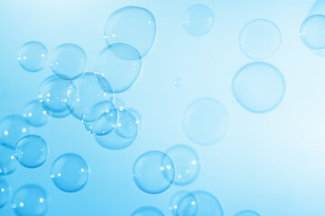 Beautiful Transparent Blue Soap Bubbles Floating in The Air. Abstract Blurred Background. Celebration Festive Backdrop. Refreshing of Soap Suds, Bubbles Water.	
