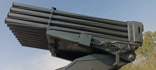 Modern multiple rocket launcher system in the parking lot. Powerful multi-barrel and long-range...