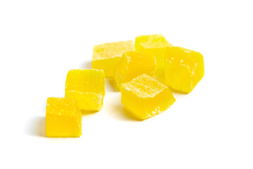 Diced mango dried fruits isolated on white background. Dehydrated mango chips dices