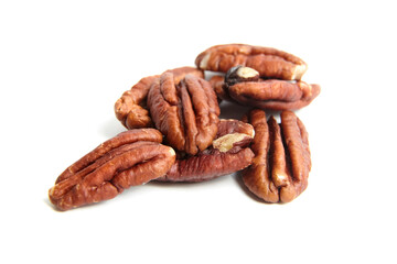 Peeled pecan nuts isolated on a white background. Heap of pecan halves