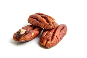 Pecan nut kernels isolated on a white background. Heap of peeled pecan halves