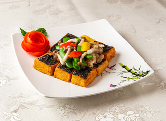 Bamboo Nori Tofu served dish isolated on background top view of hong kong chinese food
