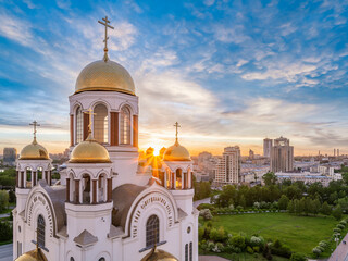 Summer Yekaterinburg and Temple on Blood in beautiful clear sunset.. Aerial view of Yekaterinburg, Russia. Translation of the text on the temple: Honest to the Lord is the death of His saints.