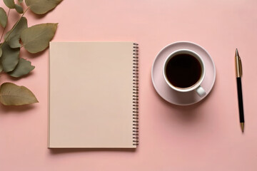 Notebook and coffee on a pink feminine desk