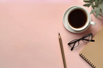 Notebook and coffee and pen on a pink feminine desk