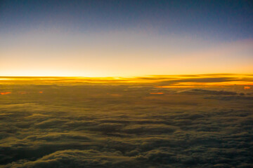 Fototapeta na wymiar Morning sunrise sky with cloud above view from airplane