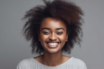 Happy African woman on grey background