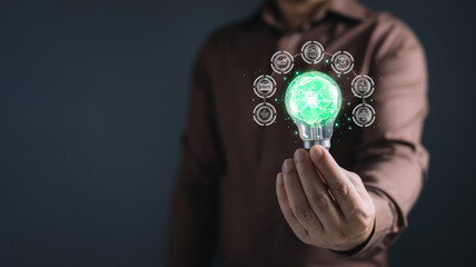 man hold lighbulb the planet to save energy,and reduce global warming,idea for environment...