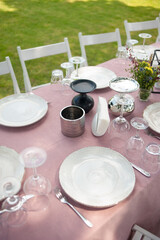 beautiful table setting with flowers and snacks at wedding reception. wedding decorations