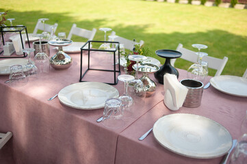 beautiful table setting with flowers and snacks at wedding reception. wedding decorations