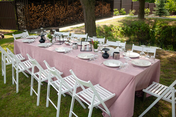 beautiful table setting with flowers and snacks at wedding reception. wedding decorations