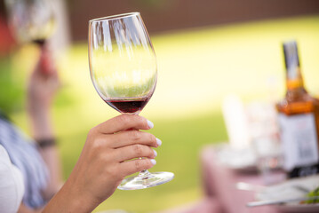 Woman relaxing with wine glass outdoor