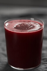 Glass of berry juice on countertop
