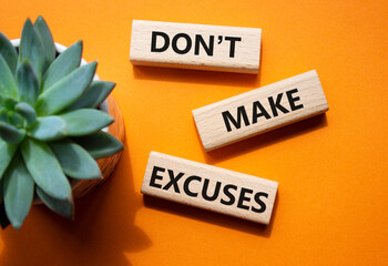 Dont make excuses symbol. Concept word Dont make excuses on wooden blocks. Beautiful orange...