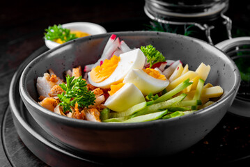 Okroshka - soup with meat, potato, kvass, radish and parsley