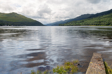 Fototapeta premium Beautiful Loch Long and the town of Arrochar in the Scottish Highlands on a sunny summers day 