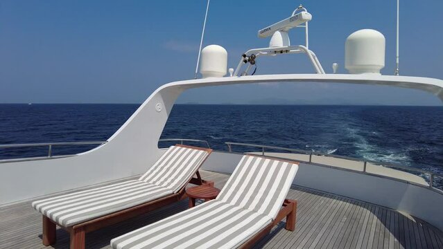 Sun loungers on the upper deck of a motor yacht, interior details of a private luxury motor yacht