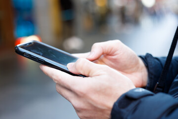 Social media and digital online concept, man using smart phone. The concept of living on vacation and playing social media. Social Distancing