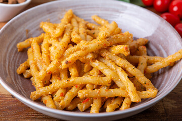 Sicilian pasta with almond and tomatoes pesto. Typical Italian food from Sicily, pasta with red pesto.