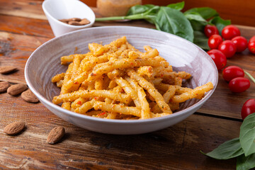 Sicilian pasta with almond and tomatoes pesto. Typical Italian food from Sicily, pasta with red...
