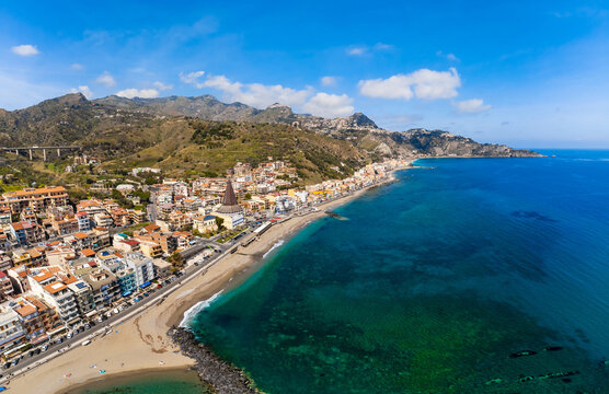 View with Giardini Naxos and Taormina, Sicily. Beach and sea in summer