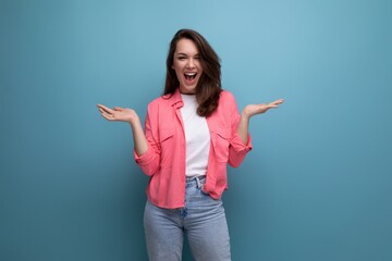 long haired brunette young woman in casual outfit posing over isolated background