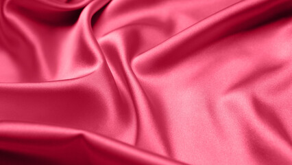Viva Magenta toned red magenta fabric atlas. Close up pink silk satin texture for sewing. Abstract background wallpaper. Twisted folds cloth. Trendy color of the year 2023. Fashion color pattern

