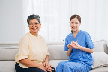 Fototapeta premium Female Dentist Providing Dental Treatment for Senior Woman at Home. Healthcare and Home Care Concept. Female professional doctor.