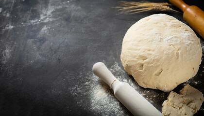 Raw yeast dough for pizza, bread or pasta. Dark food background. Copy space for text
